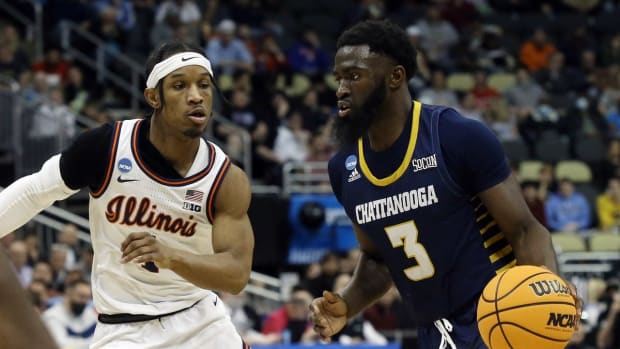 Mar 18, 2022; Pittsburgh, PA, USA; Chattanooga Mocs guard David Jean-Baptiste (3) drives to the basket against Illinois Fighting Illini guard Trent Frazier (1) during the first round of the 2022 NCAA Tournament at PPG Paints Arena. Mandatory Credit: Charles LeClaire-USA TODAY Sports